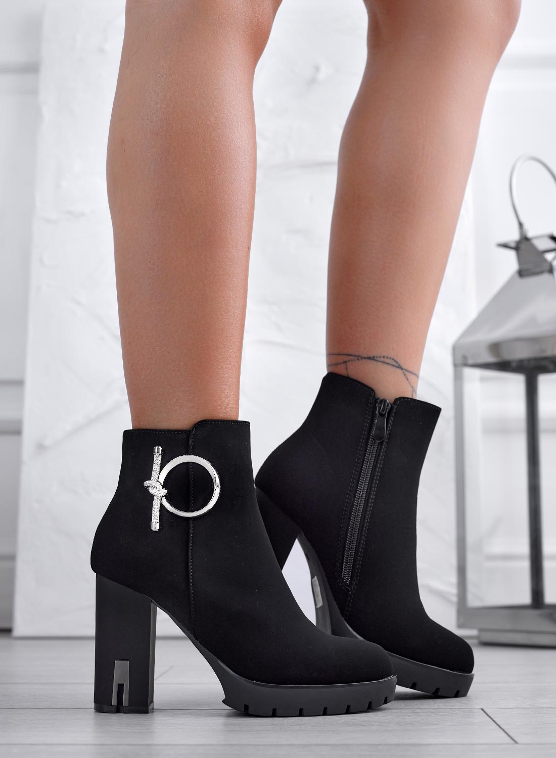 Black ankle boots with silver jewel embellishment