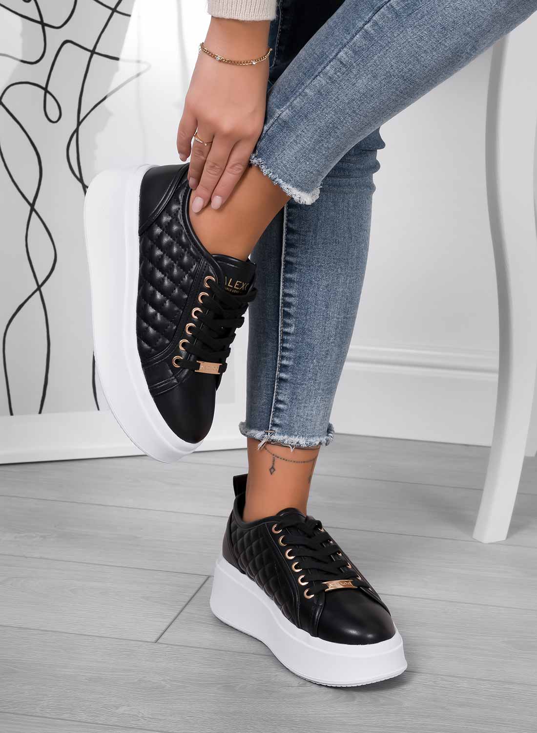 DALILA - Black quilted platform sneakers with high sole