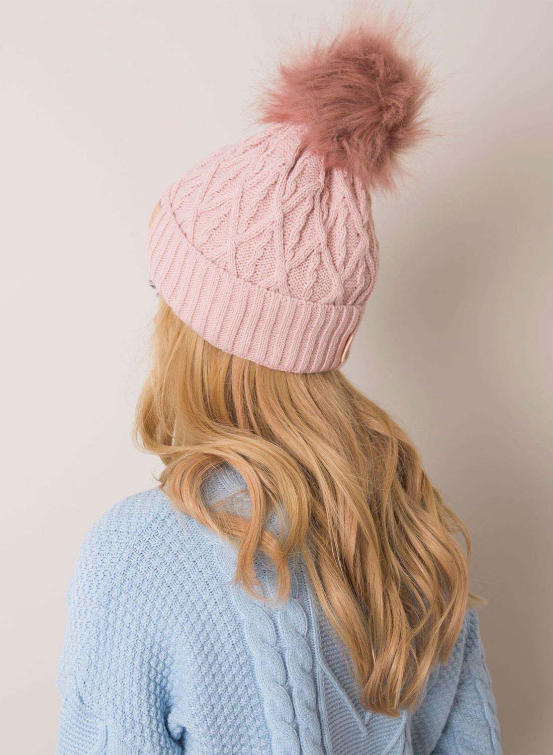 Padded pink hat with faux fur pompom