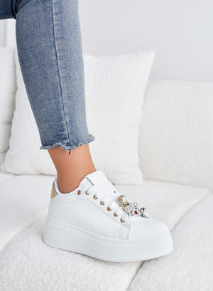 White sneakers with gold heel and jewel embellishments