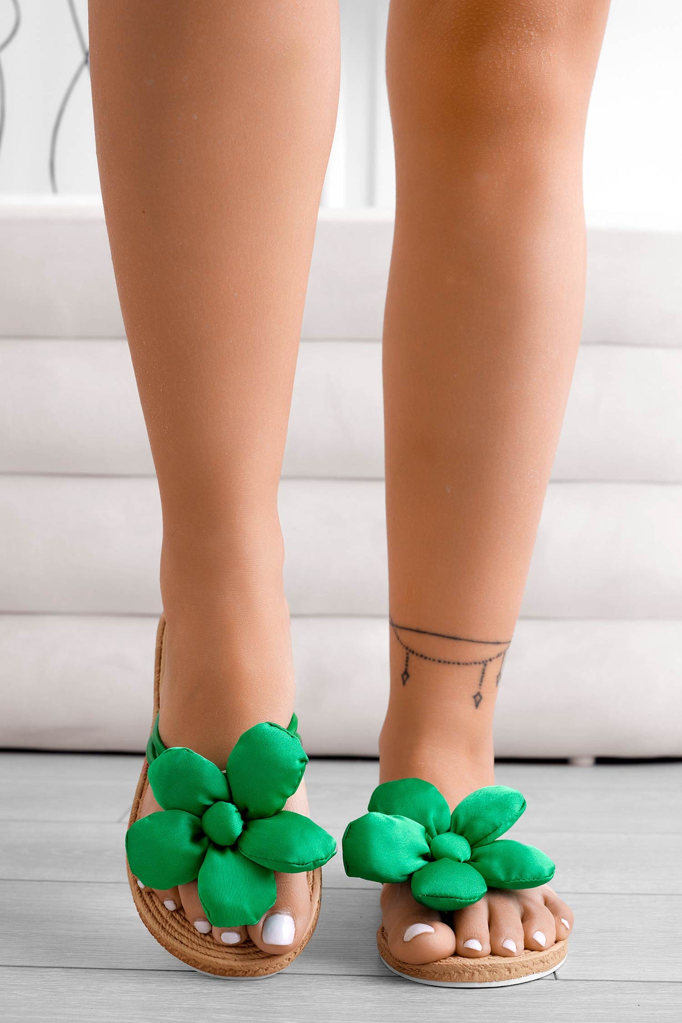 Green flat flip-flop sandals with applied flower