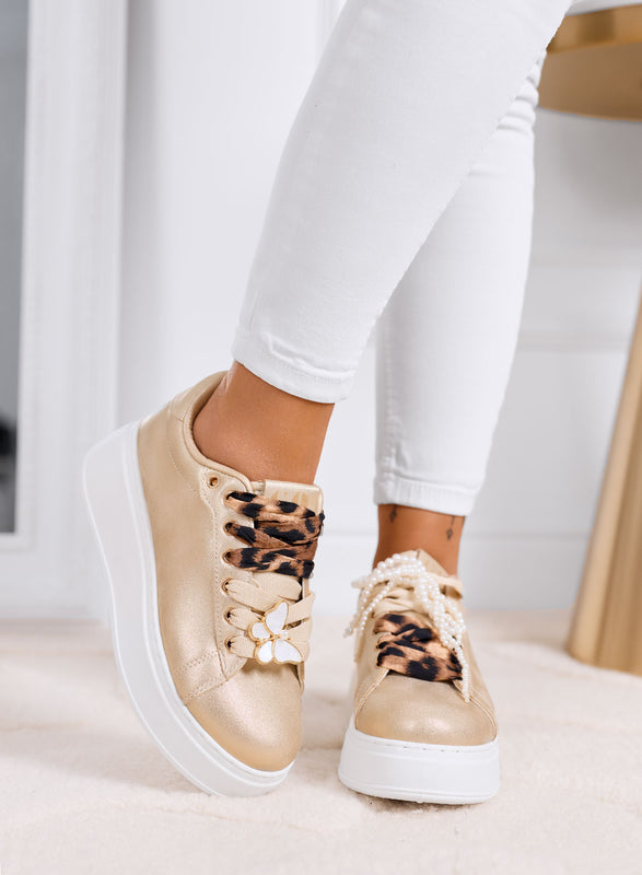 LAURA - Sneakers oro platform con lacci animalier e dettagli gioiello