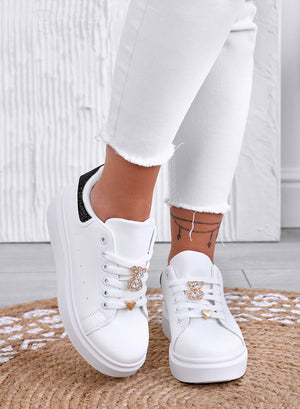 White sneakers with jewel appliqué and black rhinestone heel