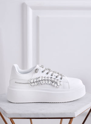 White sneakers with jewel embellishments