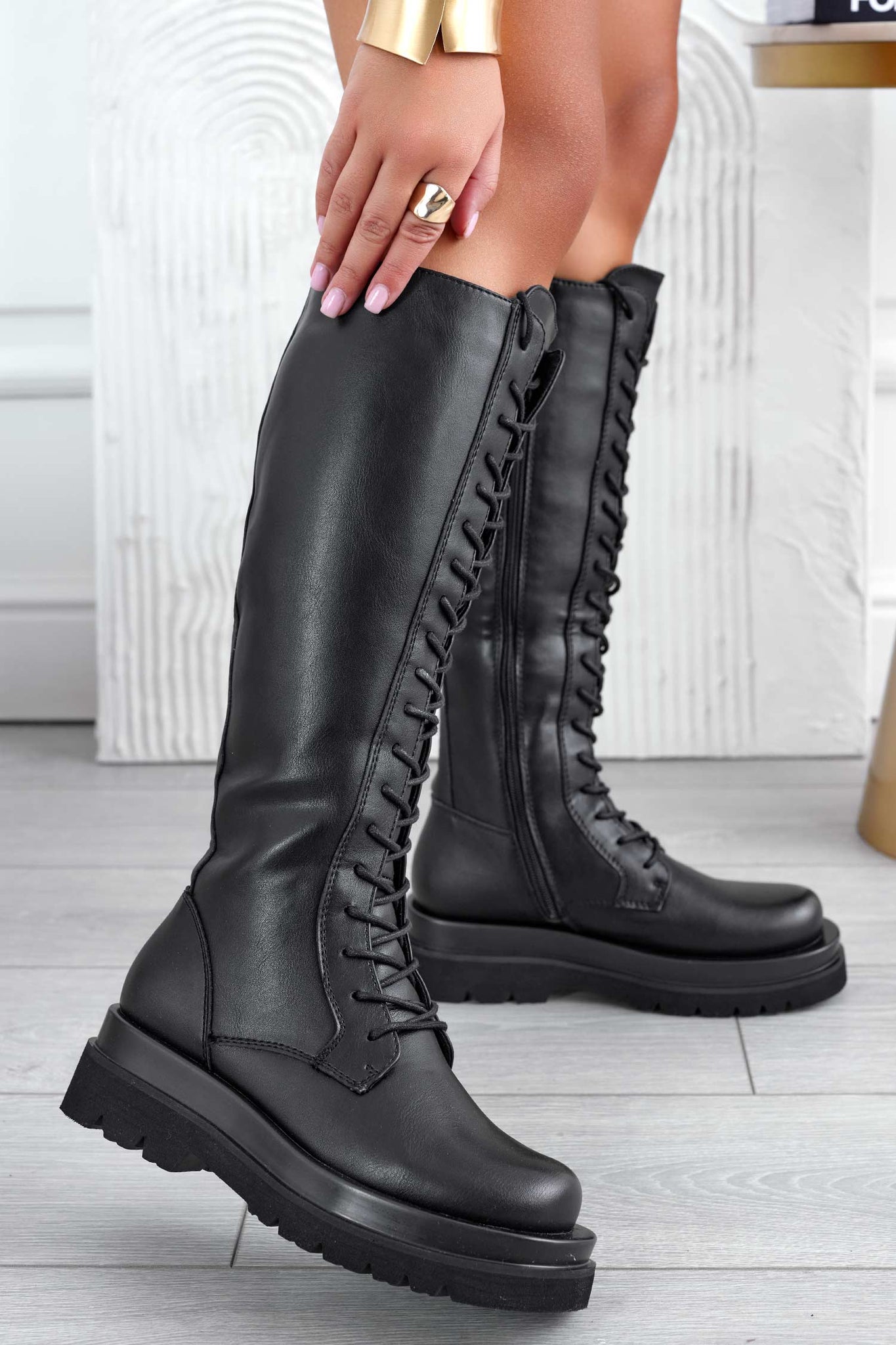 Black combat boots with laces