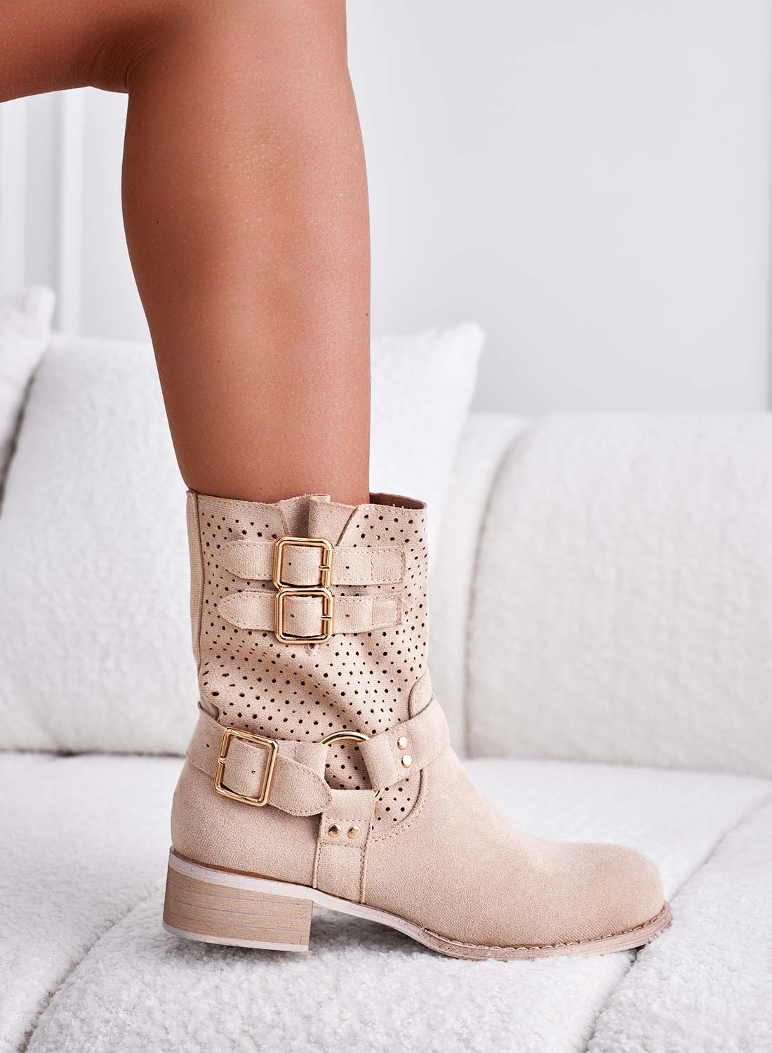 Beige perforated ankle boots with gold buckles