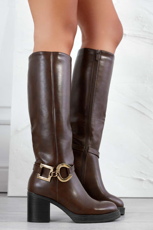 Brown boots with gold embellishments