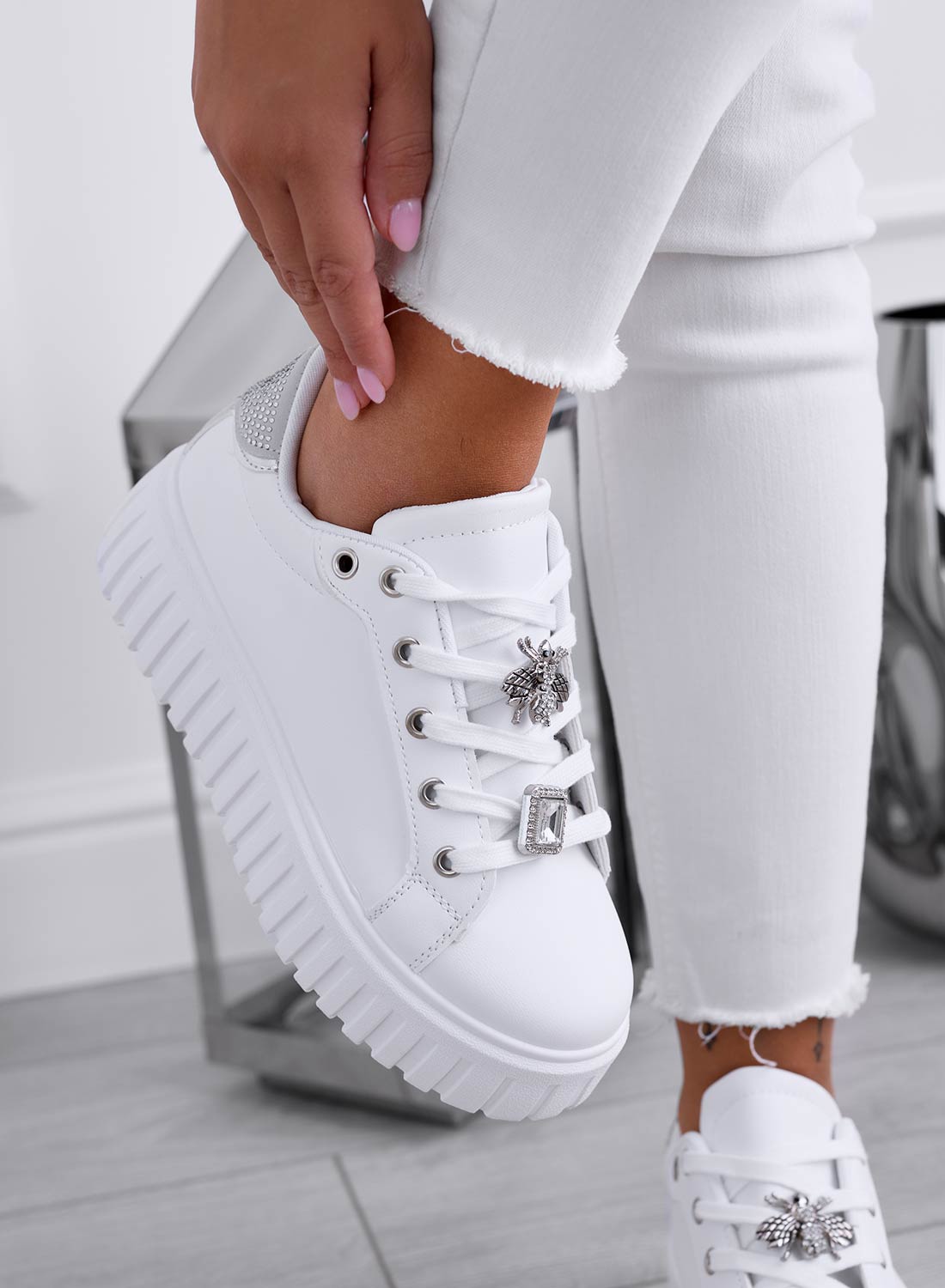 White sneakers with silver jeweled bee appliqué