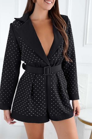 Black short jumpsuit with deep neckline and rhinestones