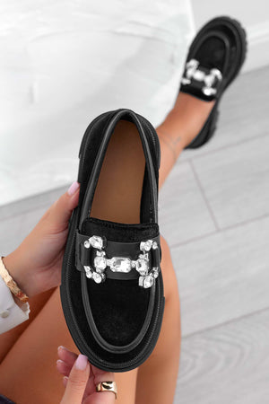 Black loafers with jewel embellishment