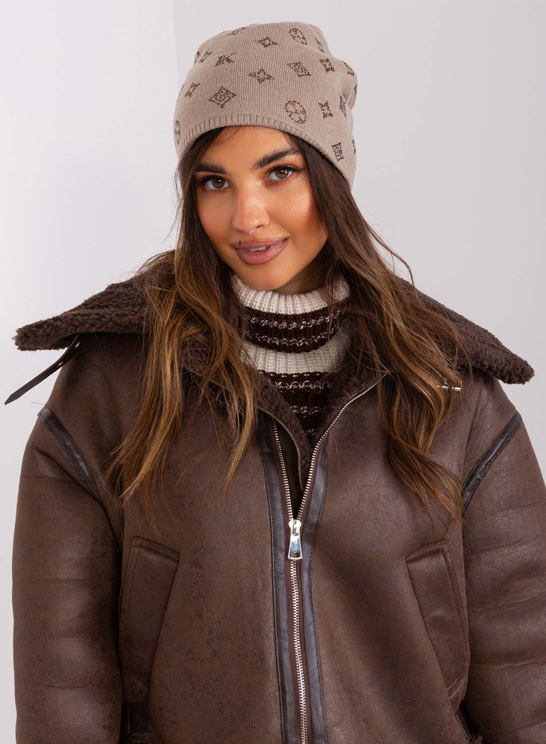 Padded mud-colored hat with rhinestone applications