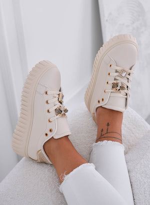 Beige sneakers with jeweled bee embellishment