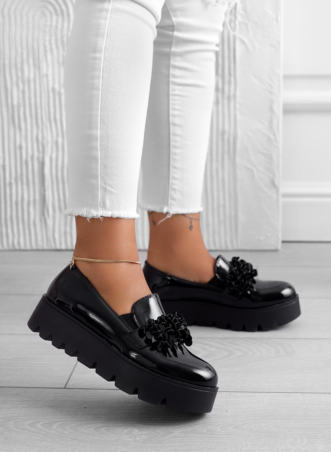 Black patent loafers with embellishments