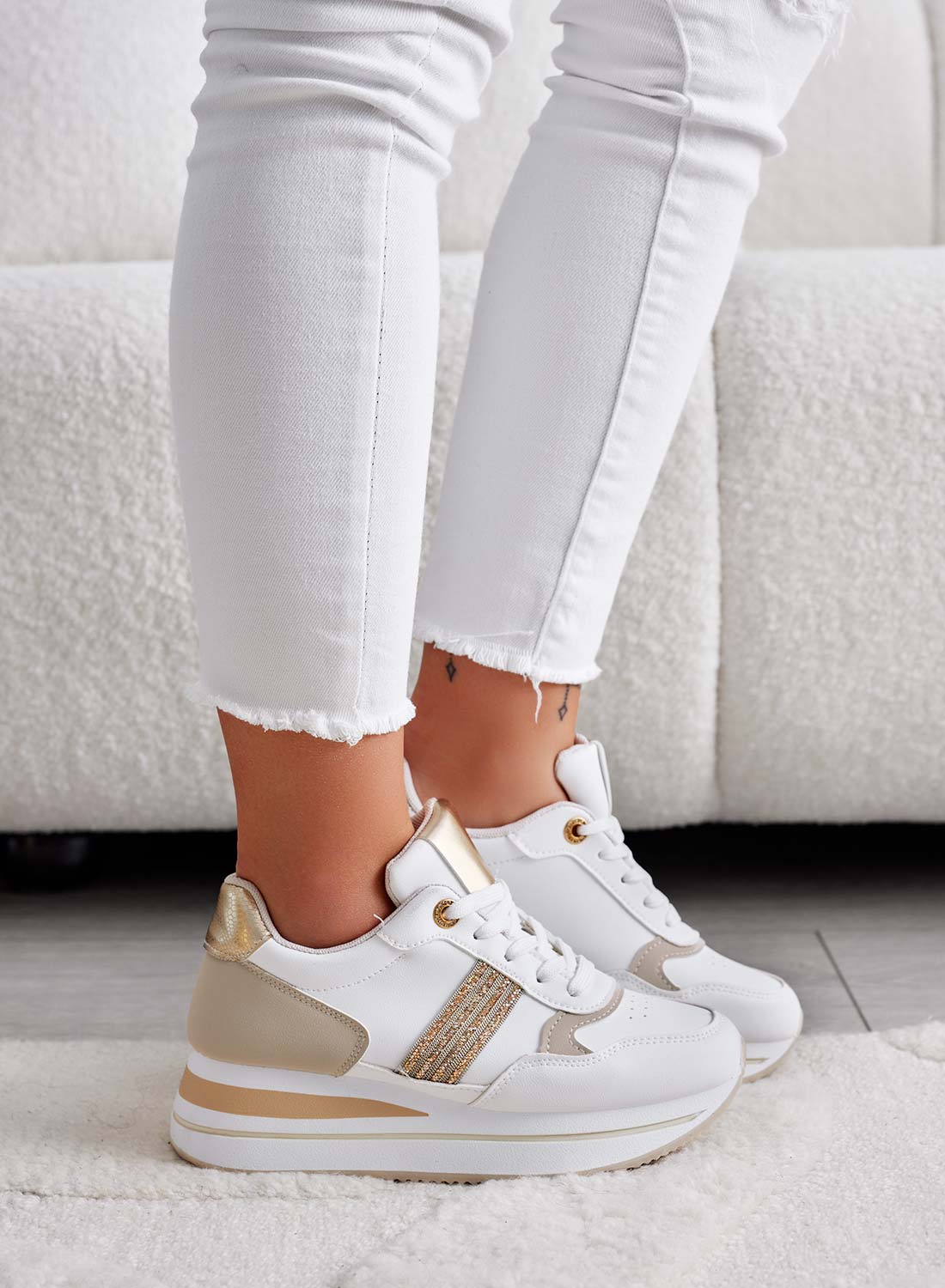 White sneakers with gold inserts and rhinestones