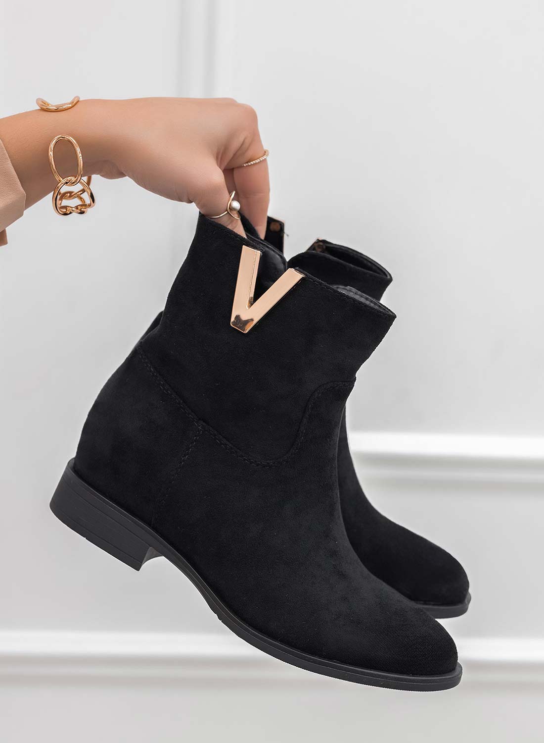 Black suede ankle boots with internal wedge