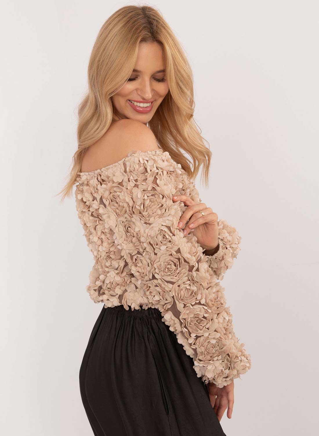 Beige sweater with floral appliqués and boat neckline