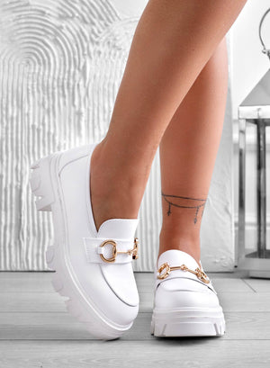 White loafers with gold buckle