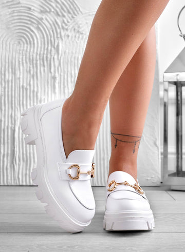 White loafers with gold buckle