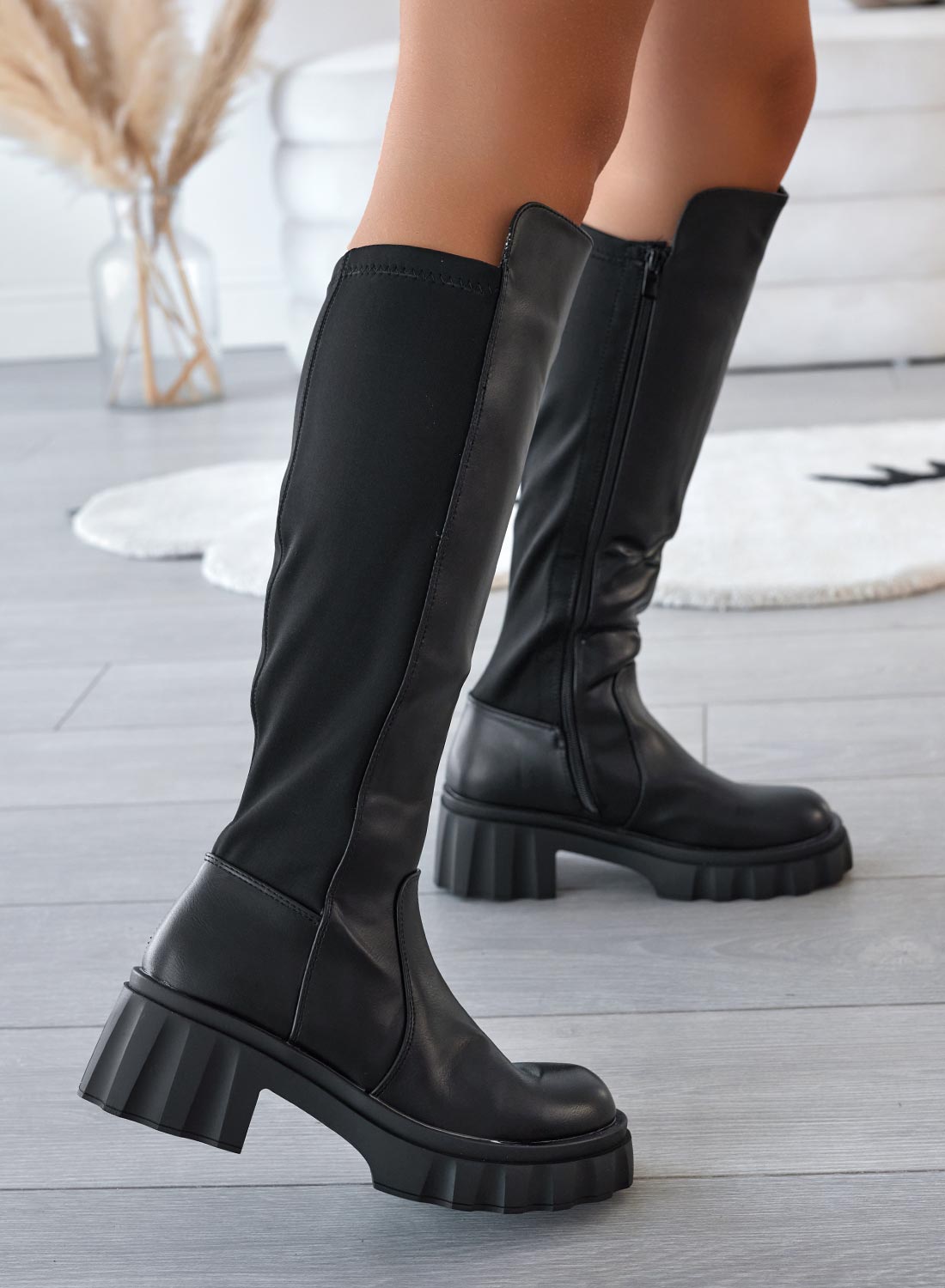 Black boots with stretch fabric at the back
