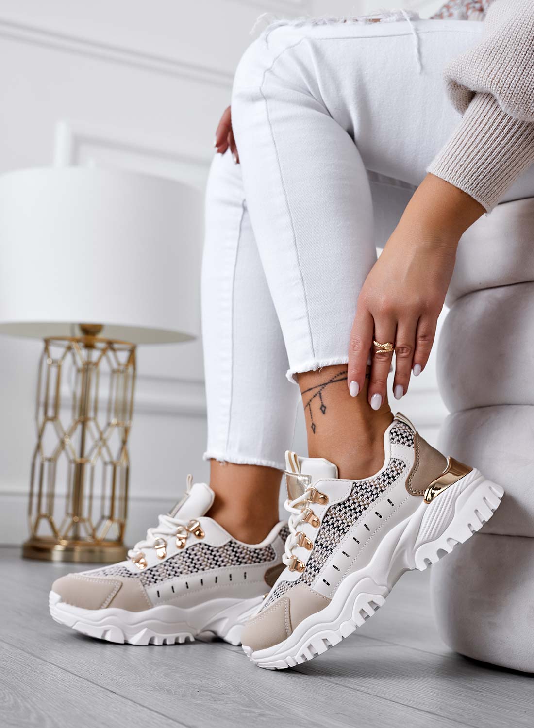 Beige sneakers with contrasting panels and fabric inserts