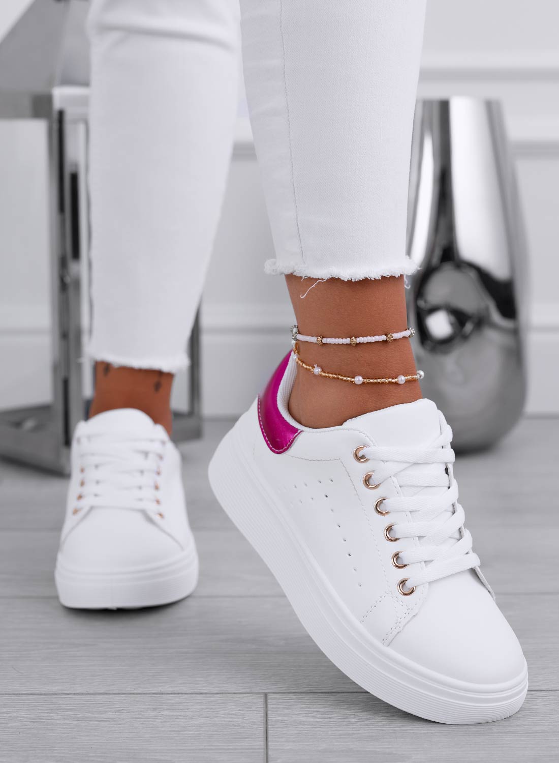 White sneakers with metallic fuchsia heel