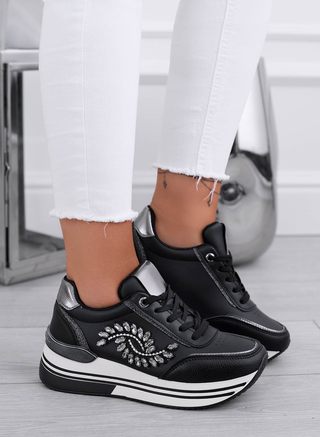Black sneakers with silver jewel embellishment