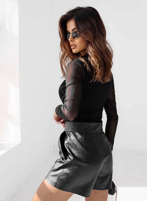 Black top with sheer sleeves and rhinestones