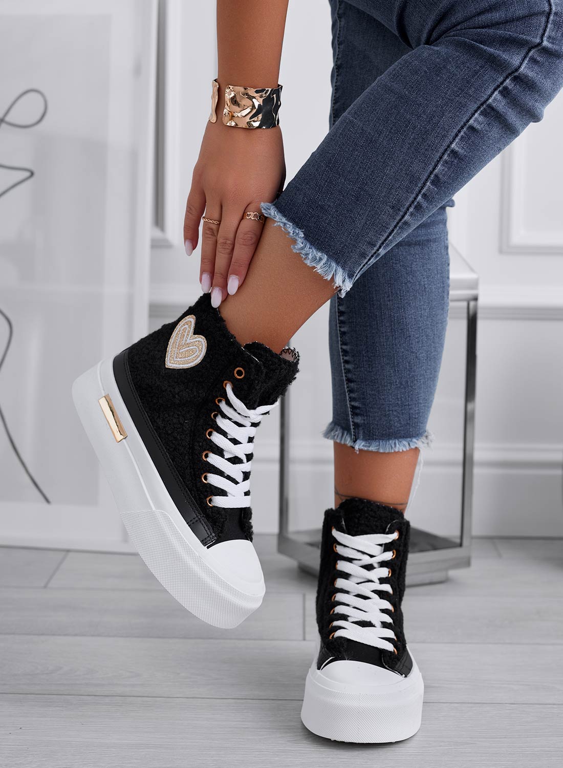 Black high-top sneakers in faux fur with gold heart