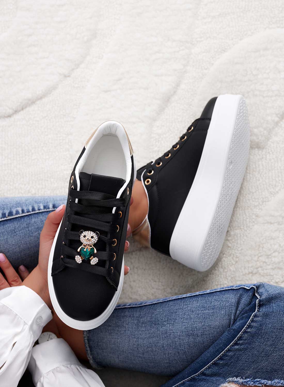 Black sneakers with gold heel and green jewel teddy bear