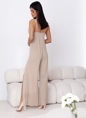 Elegant beige jumpsuit with slits on the legs