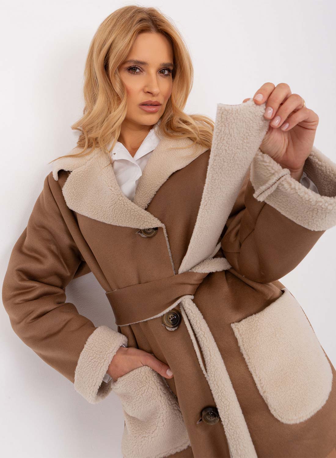 Oversized mud-colored shearling jacket with contrasting pockets