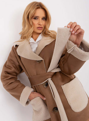 Oversized mud-colored shearling jacket with contrasting pockets
