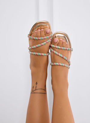 CORINNE - Gold flat sandals with multicolor rhinestone straps
