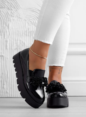 Black patent loafers with embellishments