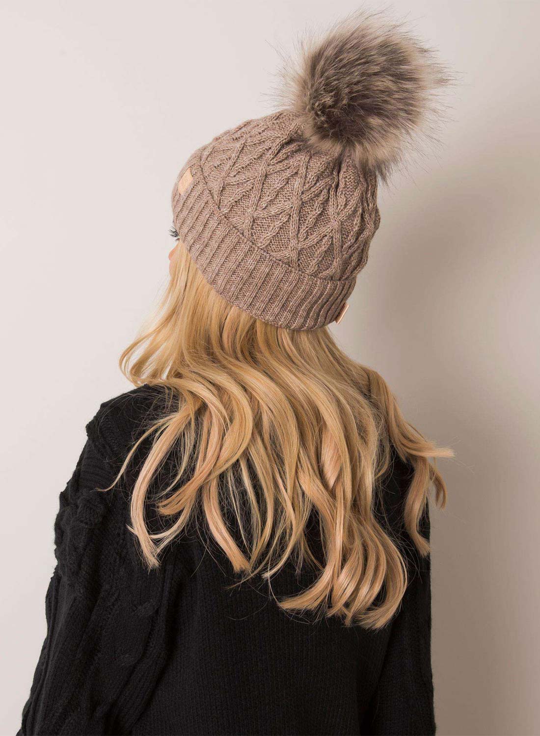 Padded mud-colored hat with faux fur pompom