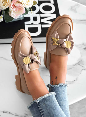 Mud loafers with bow and gold applications