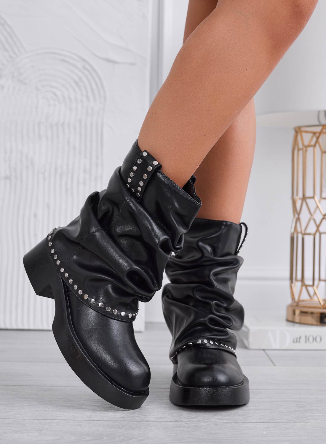Black ankle boots with ruching and studs