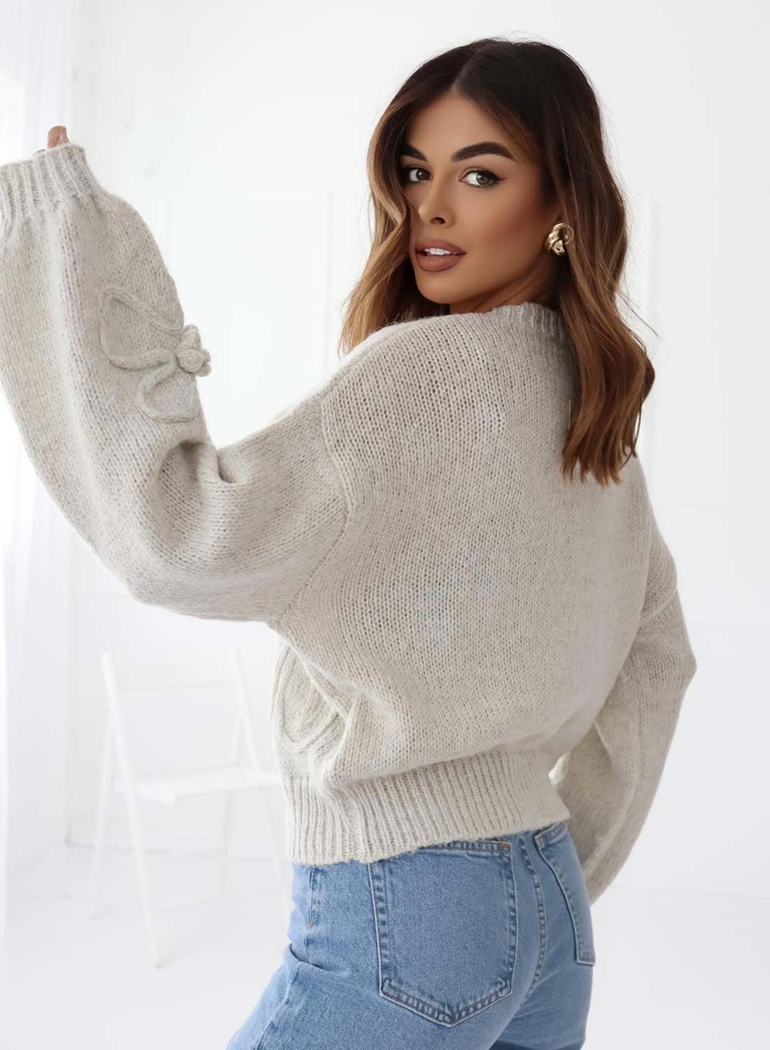 Gray sweater with embroidered flower