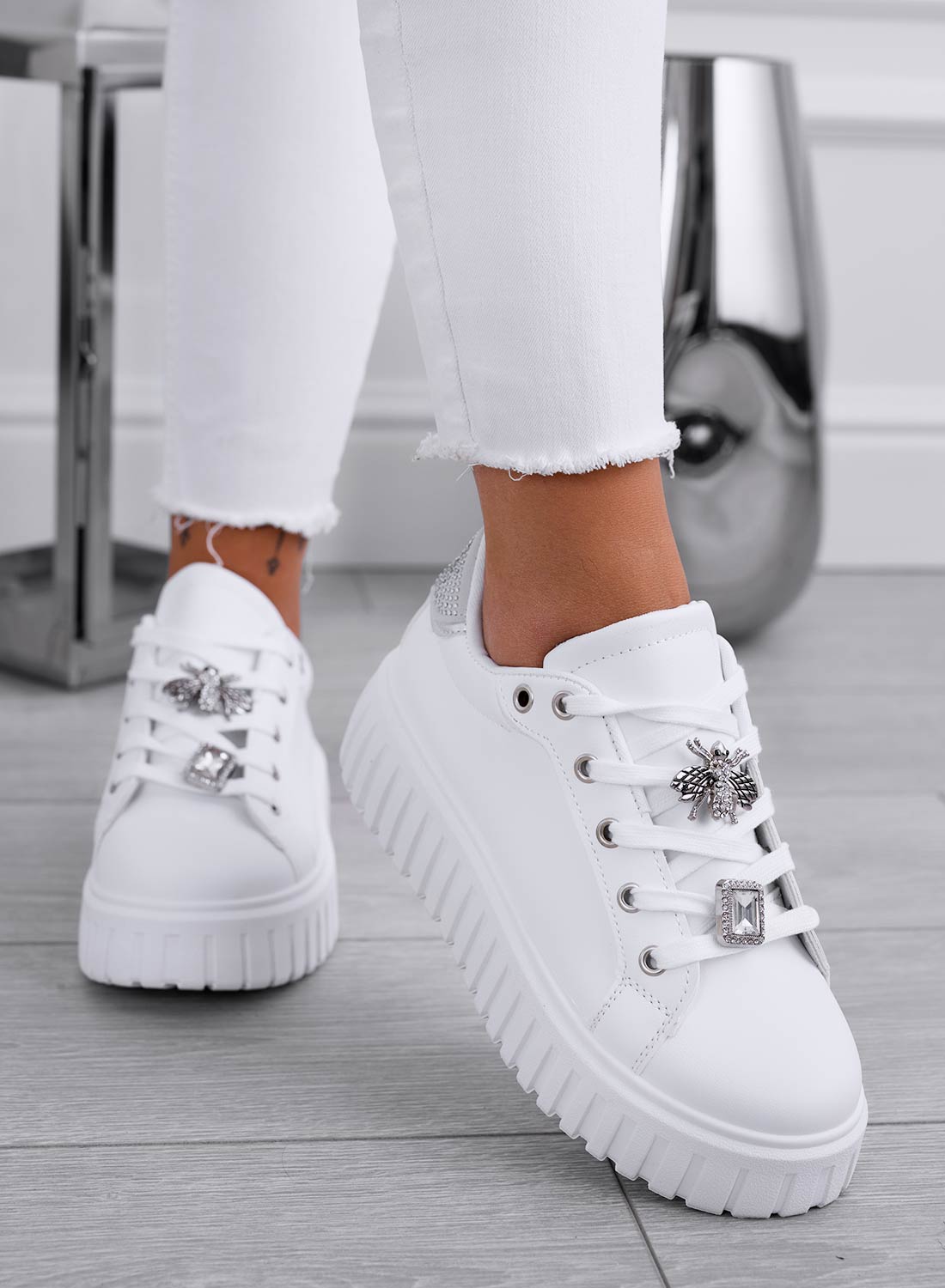 White sneakers with silver jeweled bee appliqué