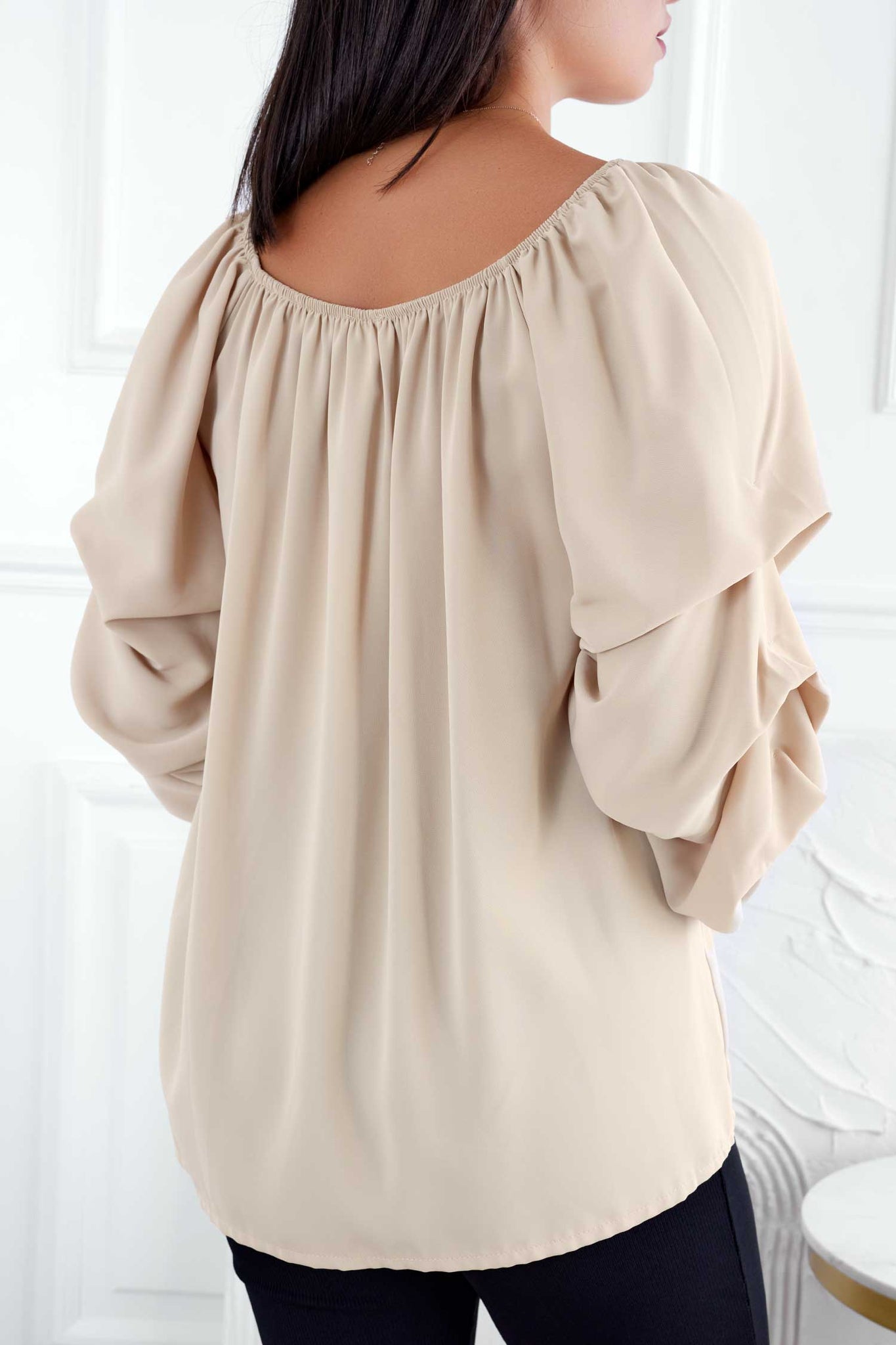 Beige blouse with ruched sleeves
