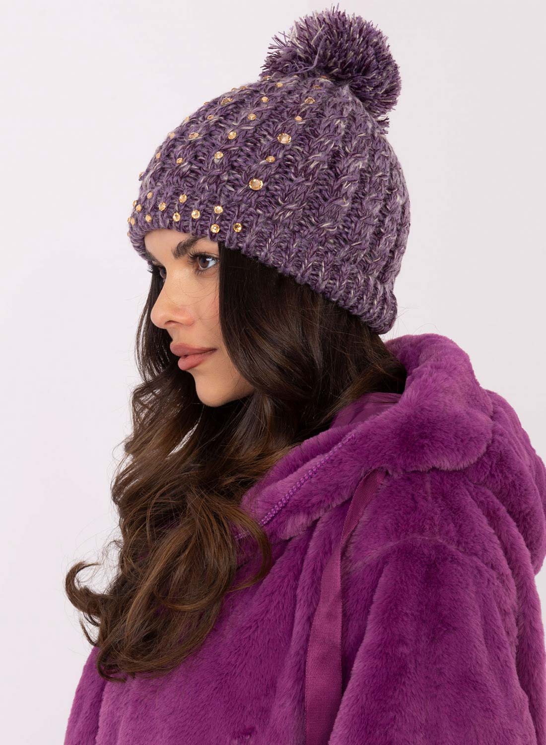 Purple padded hat with rhinestones and pompom