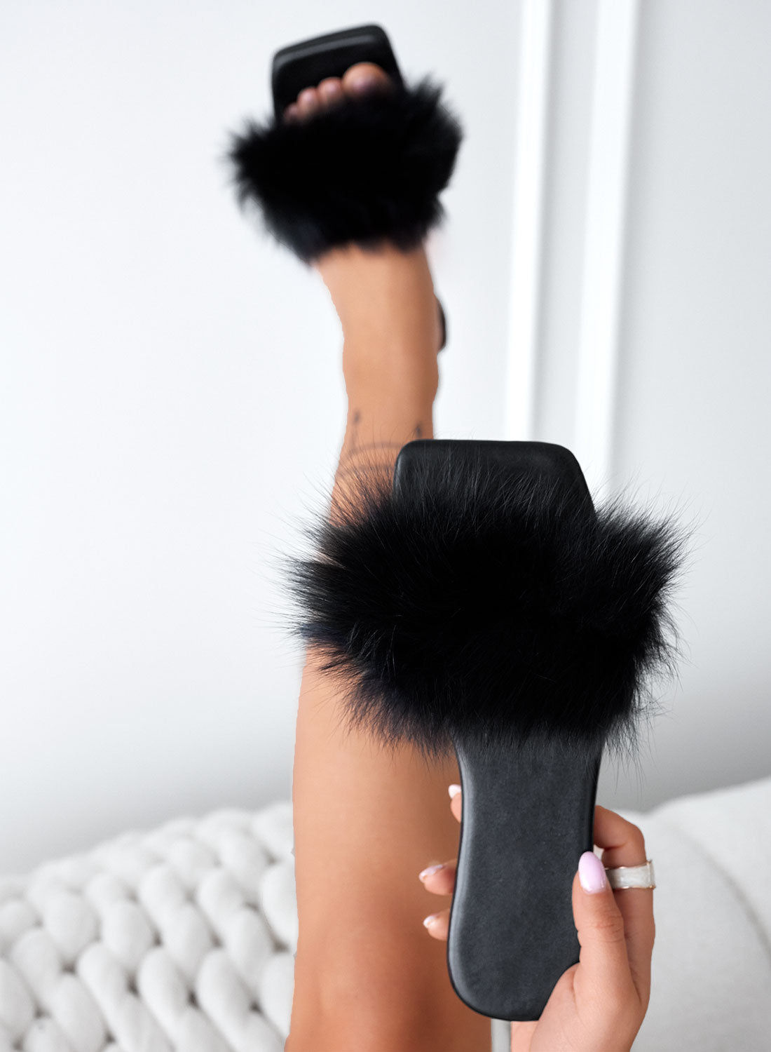 Black slip-on sandals with faux fur