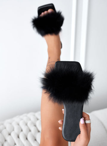 Black slip-on sandals with faux fur
