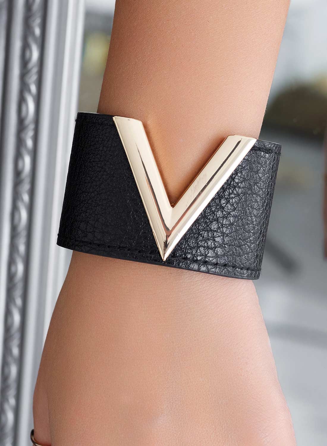 Black bracelet with gold V
