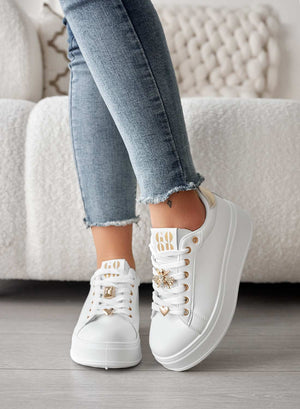 White sneakers with jewel appliqués and gold heel