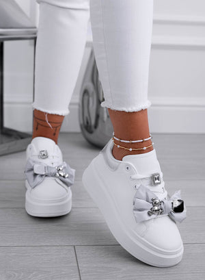 White sneakers with gray bow and silver teddy brooch