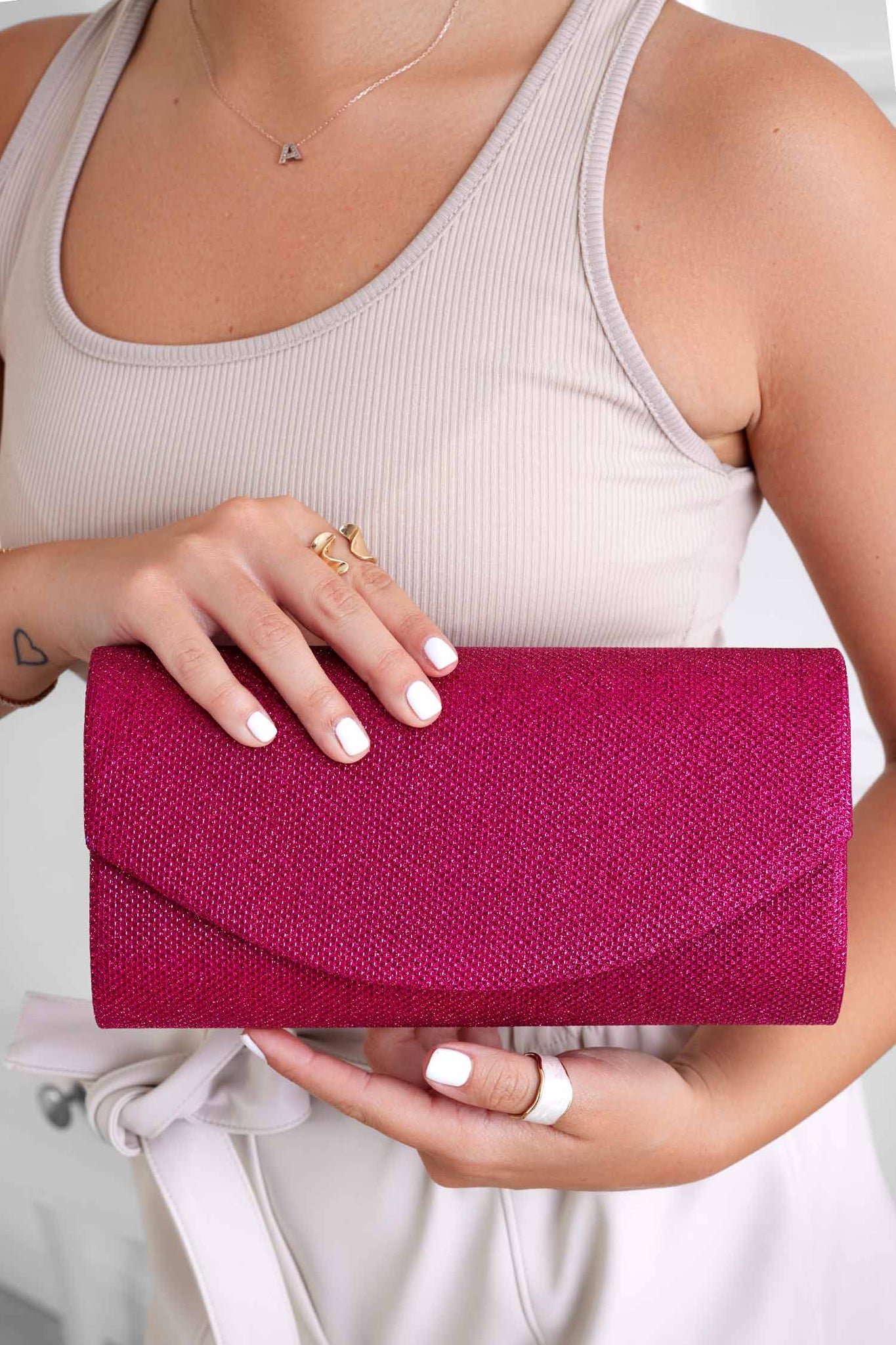 Fuchsia B220 clutch bag in laminated fabric