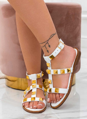 White flat Alexoo sandals with gold studs