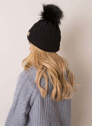 Black padded hat with faux fur pompom