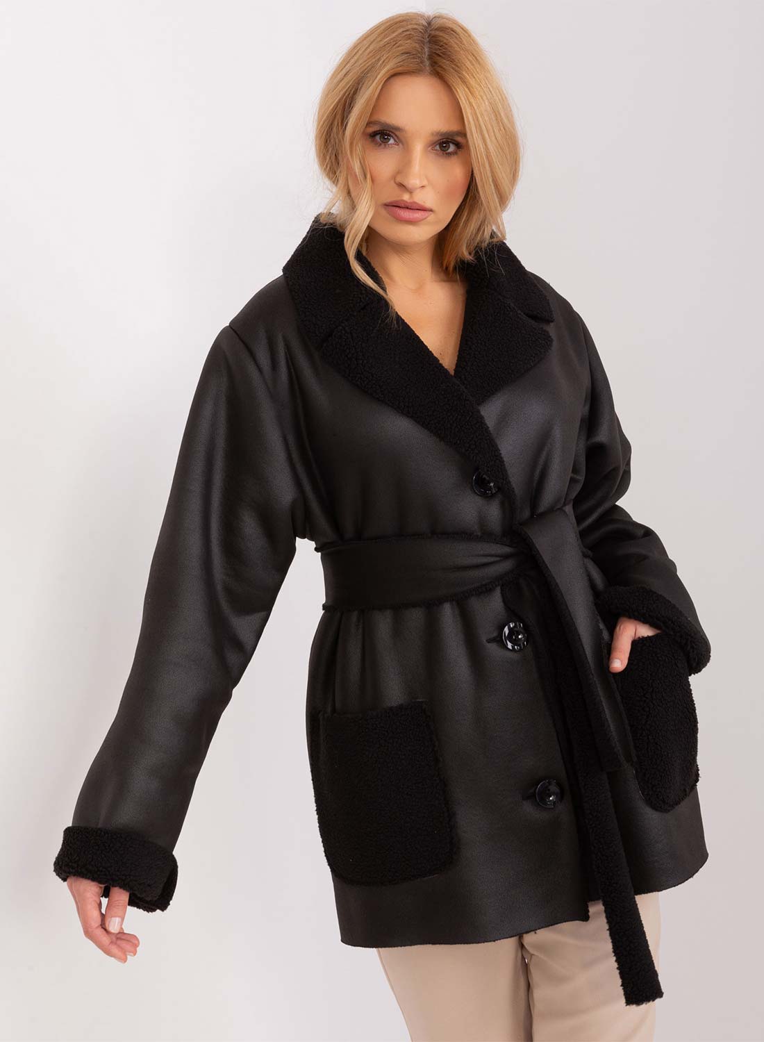 Oversized black shearling jacket with contrasting pockets